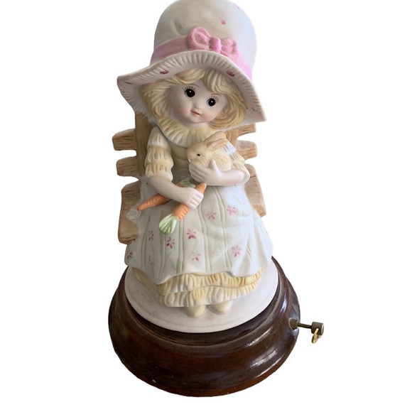 Sankyo Other - Porcelain child with bunny sitting on bench musical plays “It’s a small world”.